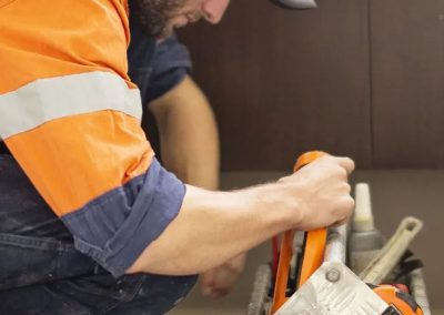 Plumber going through tool box